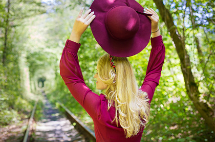 beautiful girl in cherry dress with a hat in woods, a Person Photo by Artsaba Family