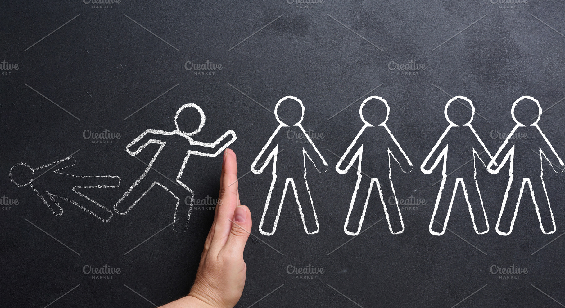 A hand stops a chain reaction of falling figures drawn in chalk, a Business Photo by ndanko
