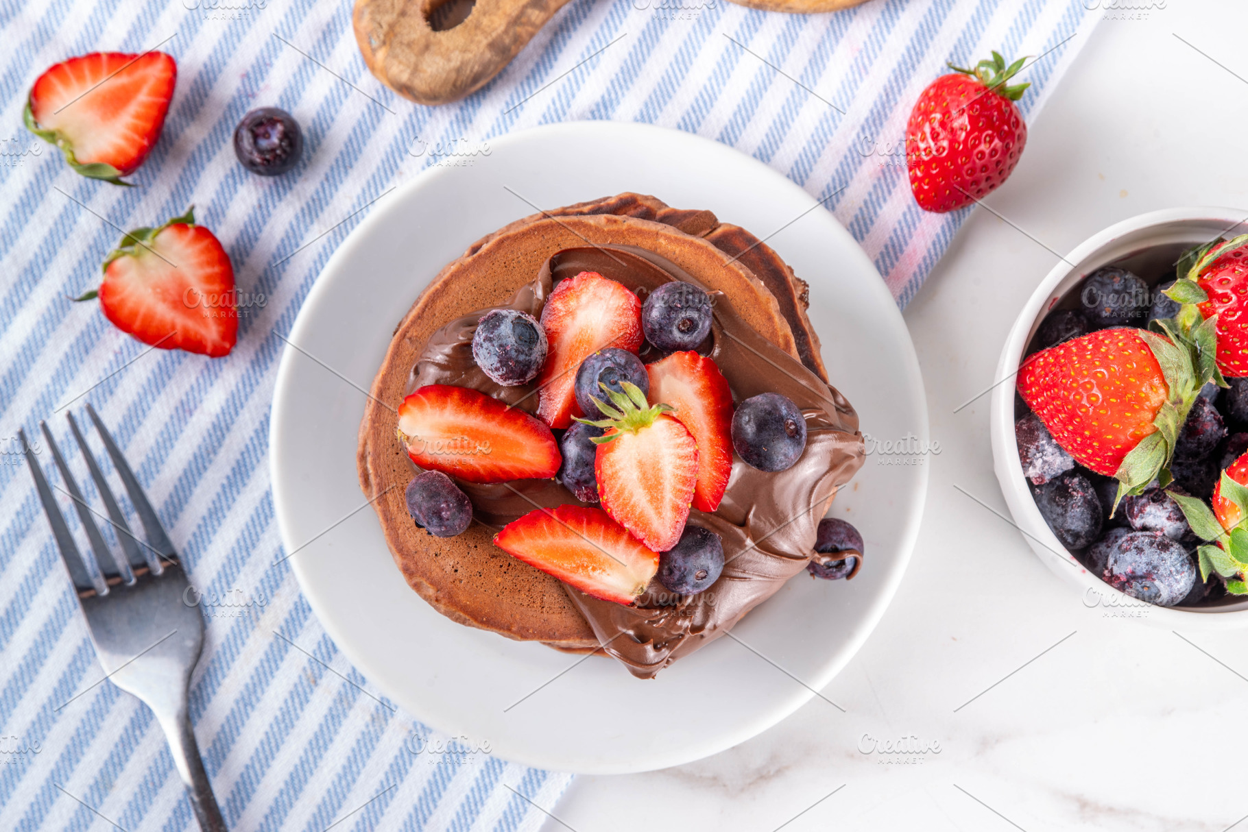 Stack of chocolate pancakes with chocolate paste topping and fre, a Food & Drink Photo by Rimma