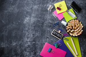 School stationery supplies pencil pen note on grunge chalkboard containing