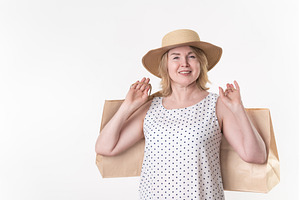 Smiling woman shopper in white dress, a Person Photo by Alexander-Piragis