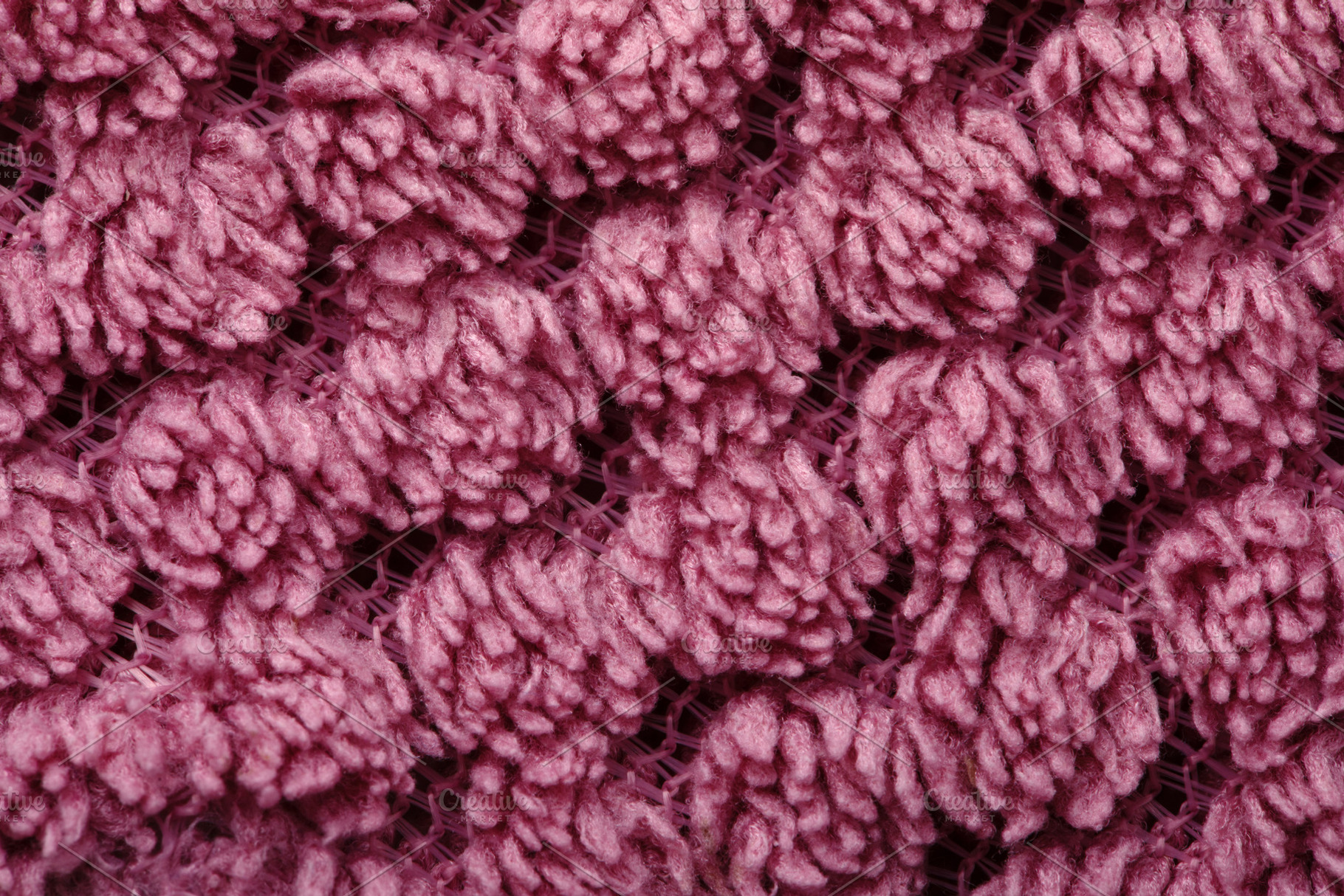 Detailed macro of pink yarn with intricate looped texture, ideal, a Background Photo by Ales Munt