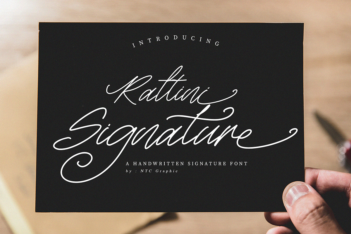 Rattini Signature Font, a Script Font by NTC Graphic (Photo 1 of 10)