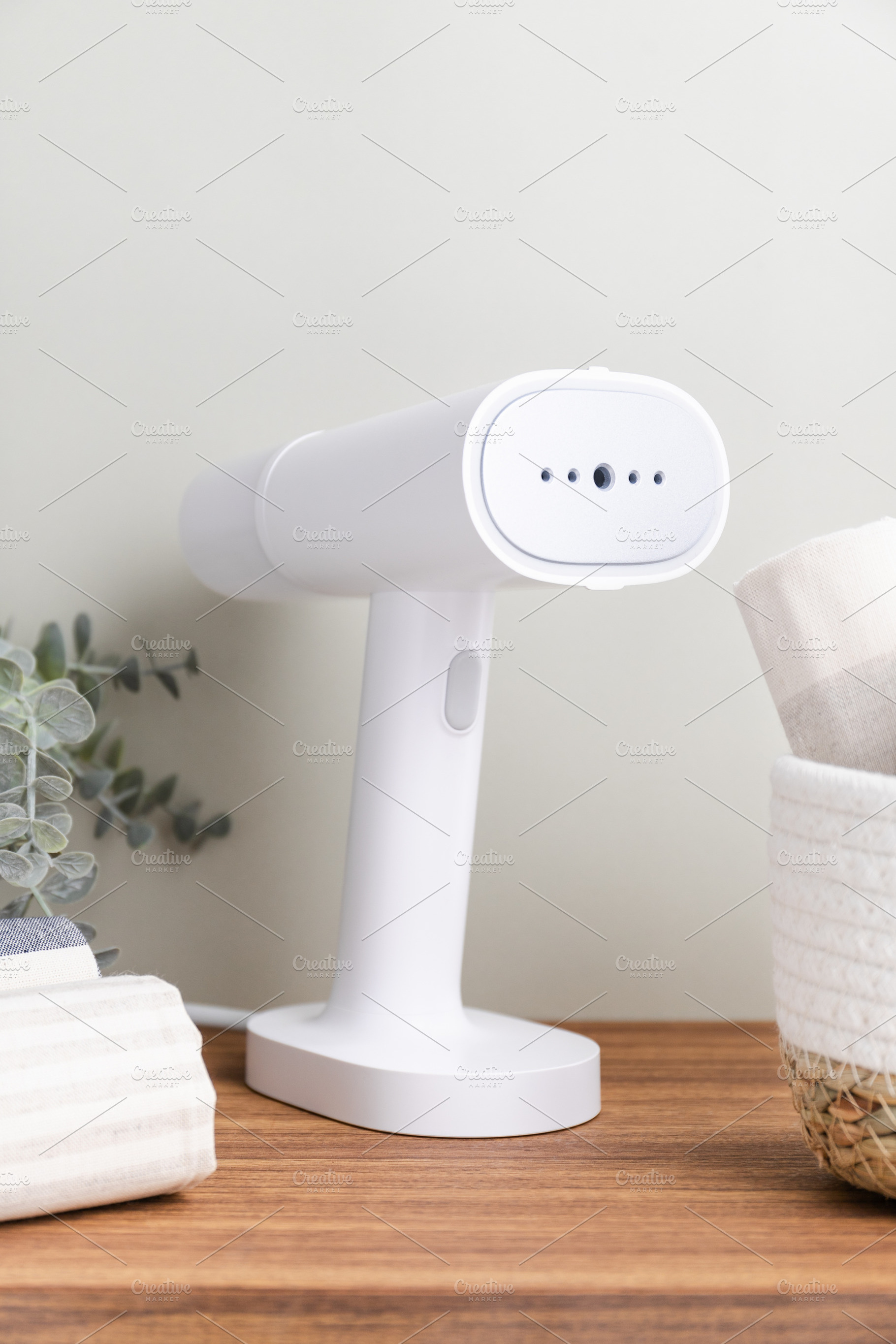 White handheld portable steamer next, a Technology Photo by Edalin's Store