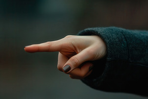Close up of a woman's hand pointing, a Photo by Pavel_design