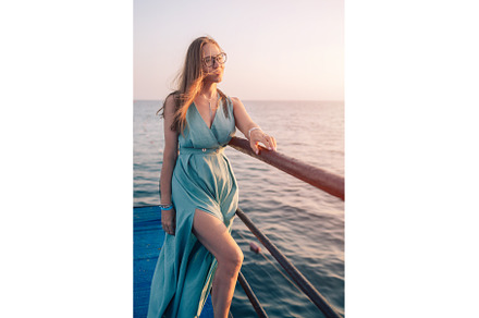 Woman in Flowing Dress on Seaside, a Person Photo by Jan Jack Russo Media