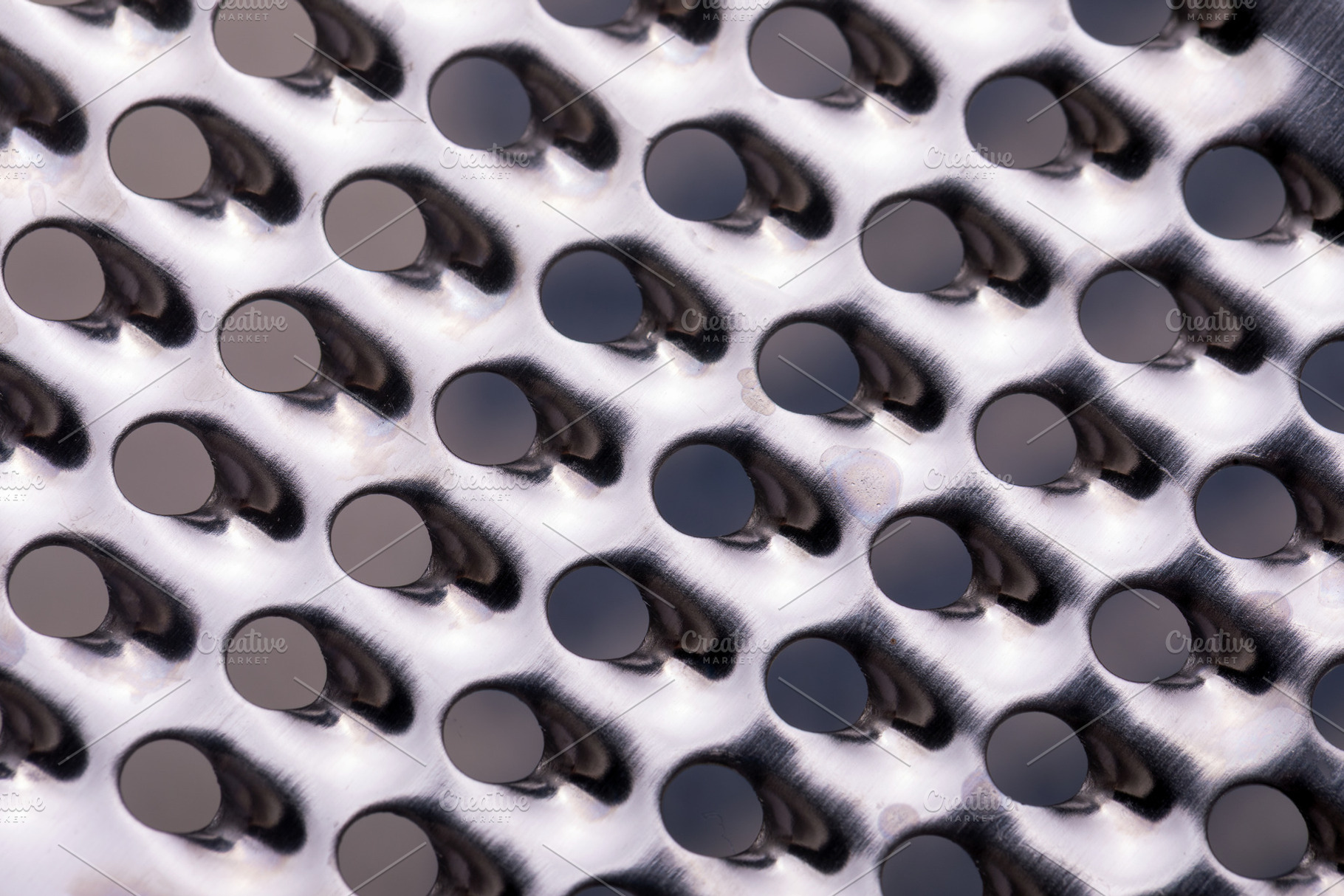 Close-Up of Metal Grater Surface, a Background Photo by Ales Munt