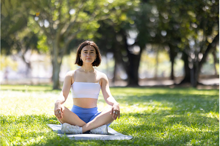 A woman is sitting on a mat in a, a Sports & Recreation Photo by Barcelona_dreams