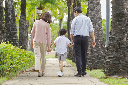Portrait of happy smiling Asian Family walking together in publi, a Photo by Tampatra