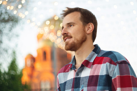 Smiling man enjoying festive evening