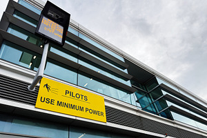 Pilots sign on modern airport building facade in Dublin, Ireland advising use m, a Photo by AS photostudio