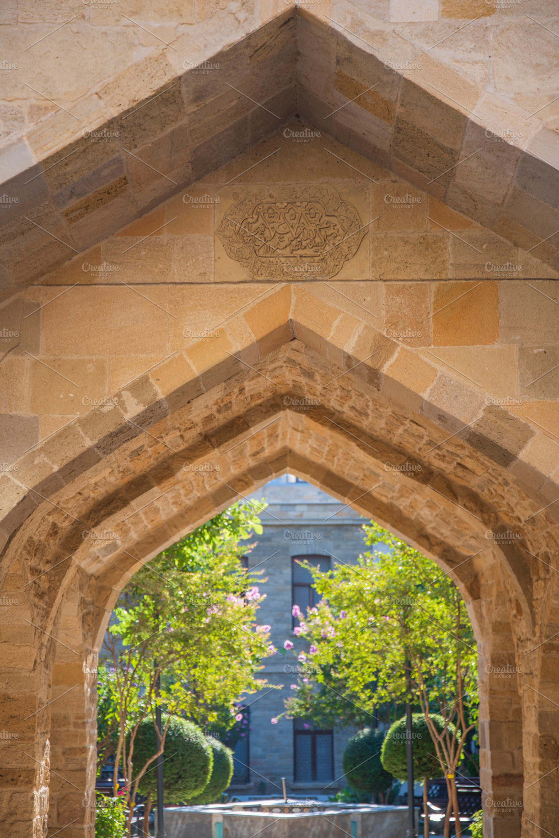 Vertical stone arch in old Baku with carved medallion and copy s, a Photo by Pictures for you!!!!!!!!!