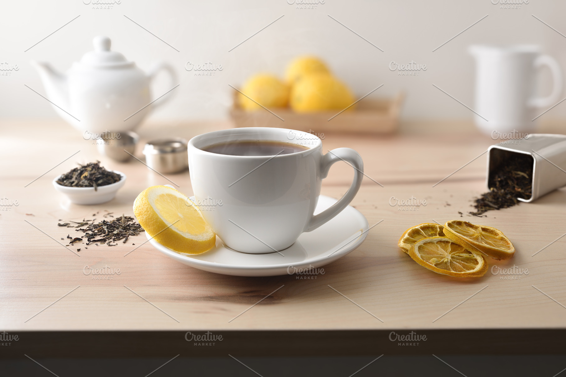 Hot tea on table with lemon tea and kitchen items, a Food & Drink Photo by Davizro's Market