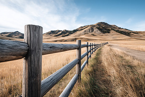 Wooden fence stretching across, a Nature Photo by MistyDay
