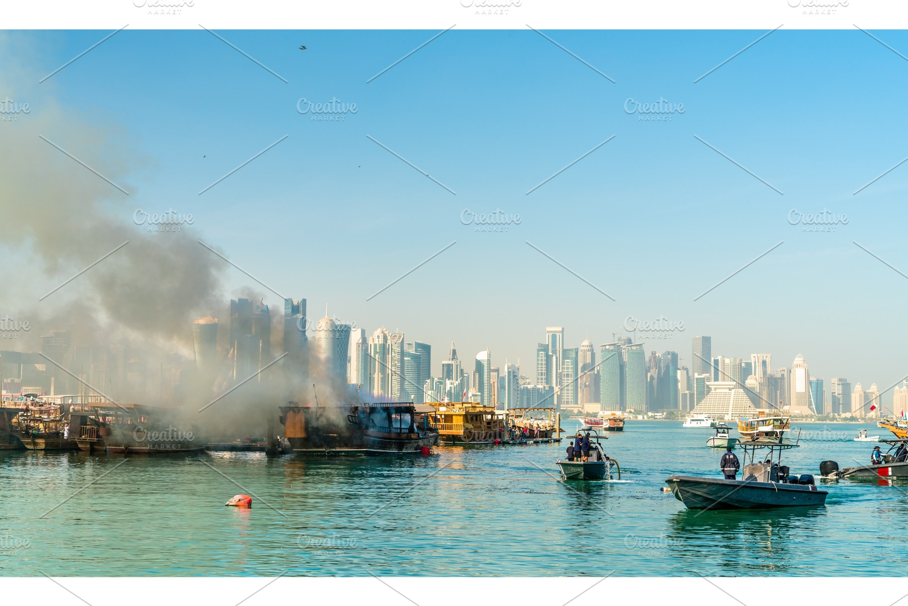 Traditional arabic dhow on fire in doha qatar featuring doha, qatar, and boat, a Transportation Photo by Leonid Andronov