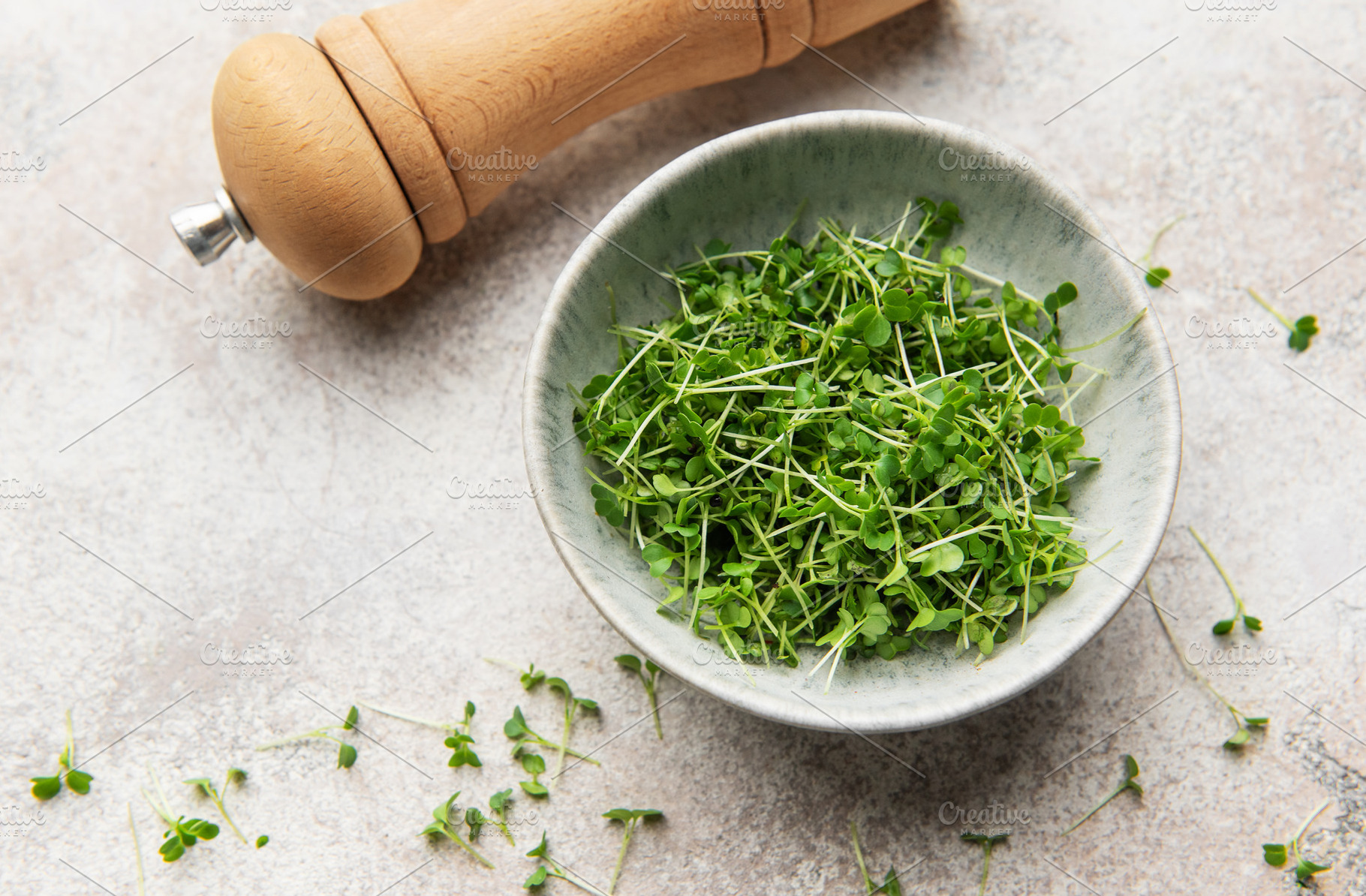 Microgreens in bowl with wooden pepper mill, a Food & Drink Photo by Olena Rudo