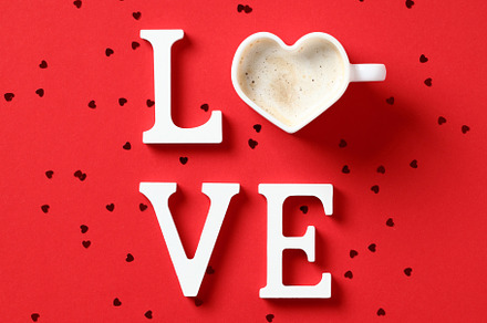 Word Love made of letters and heart shaped cup of coffee on red background with, a Holiday Photo by photoguns