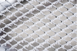 Close-up view of frost-covered metal, an Abstract Photo by volodymyrshtun13795