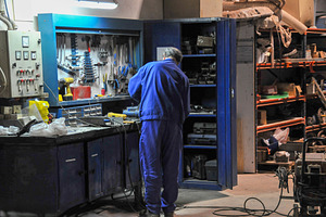 Industrial Technician Working at Organized Workshop Bench, an Industrial Photo by Davizro's Market