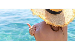 The child has sunscreen on his back, a Holiday Photo by yanadjana