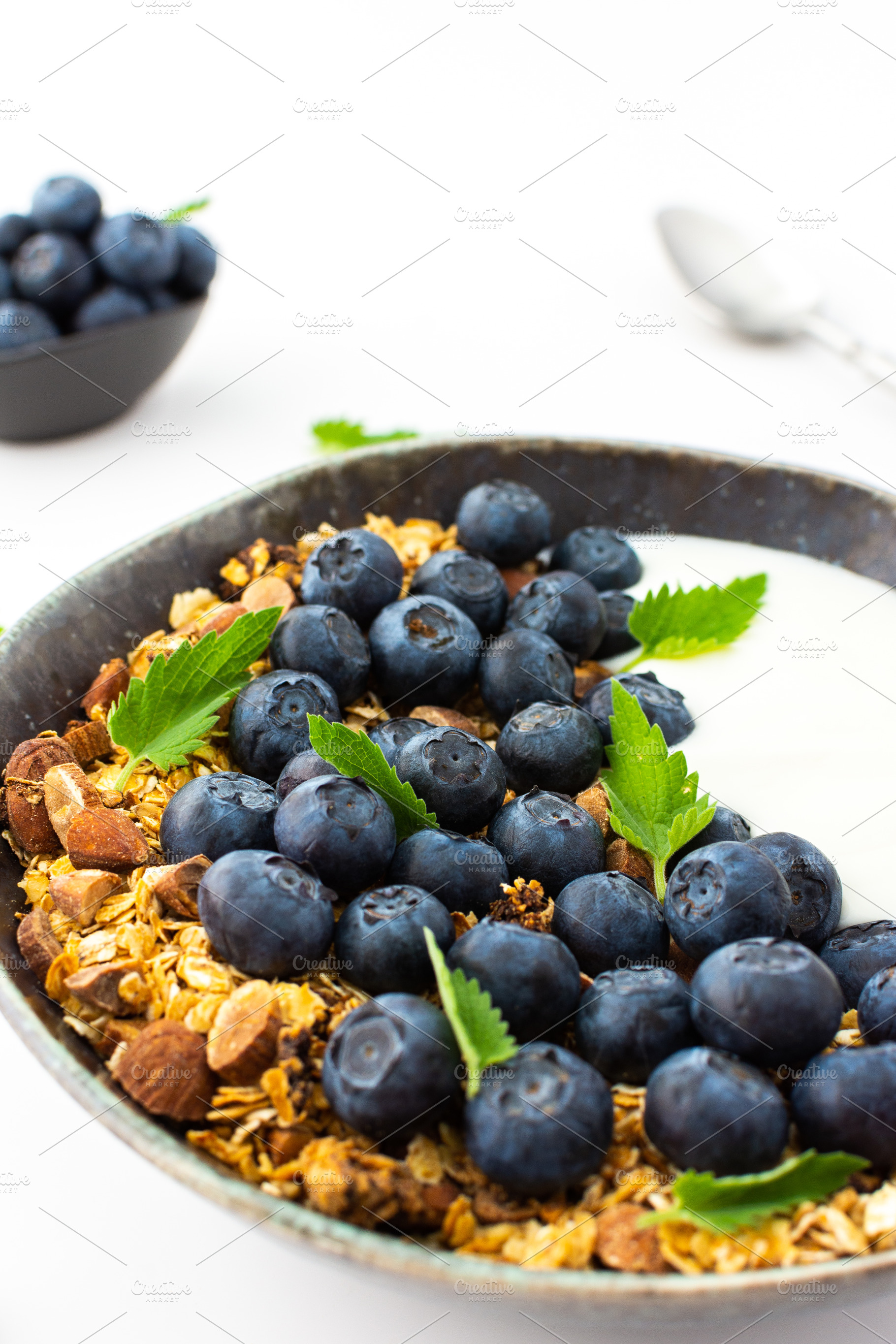 Granola with yogurt and blueberries, a Food & Drink Photo by Pandateam