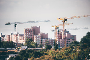 Tower Cranes Around Housing Blocks, an Architecture Photo by SkyNext