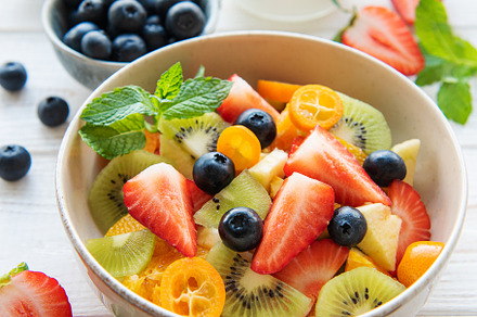 Healthy fresh fruit salad in a bowl, a Food & Drink Photo by Olena Rudo