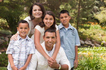 Happy hispanic family in the park containing american, boys, and cheerful, a Person Photo by Andy Dean Photography