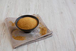 Organic Demerara Sugar in a Bowl, side view. Copy space., a Food & Drink Photo by LiudmylaChuhunova