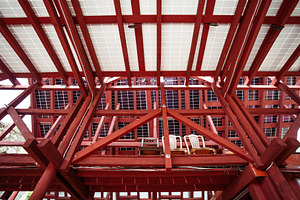 Red wooden attic with solar panel, an Architecture Photo by SkyNext