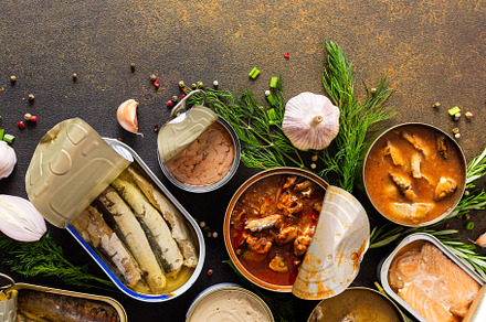 Open tin cans with canned fish, a Food & Drink Photo by Pandateam