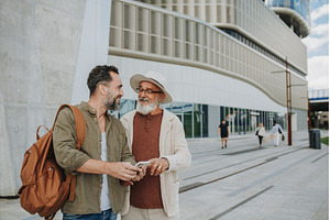 Mature son and father traveling, a Person Photo by HalfPoint