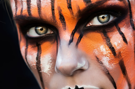 Close - up photo of a woman's face with Halloween makeup. Genera, a Holiday Photo by designvectx