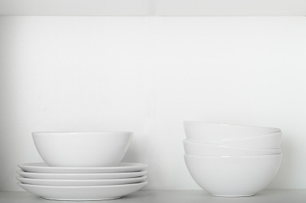 White plates and bowls on a shelf