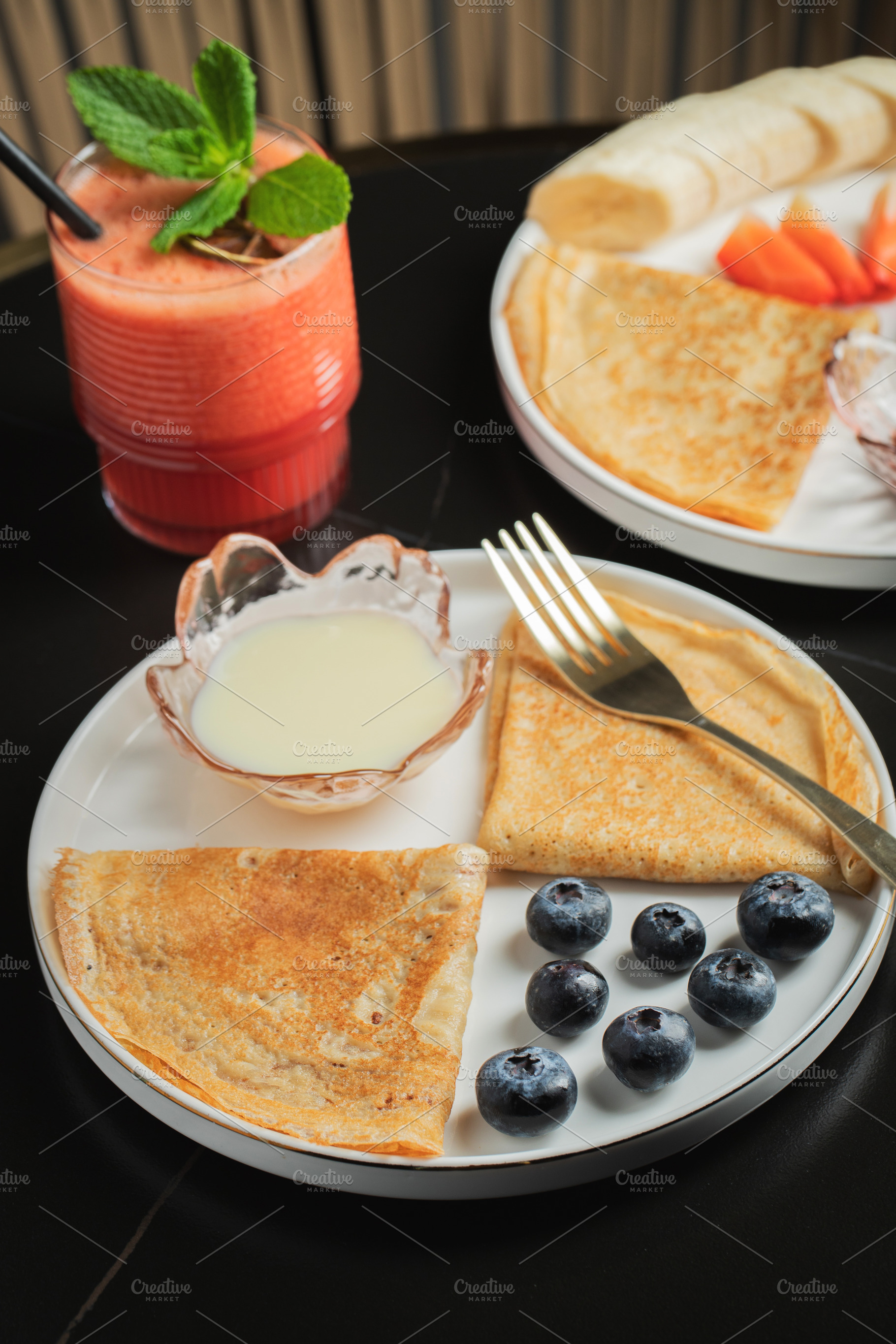 Pancakes with blueberry and honey on a white plate, a Food & Drink Photo by Budarinphoto