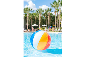 Colorful beach ball floating in, a Holiday Photo by Lermont51