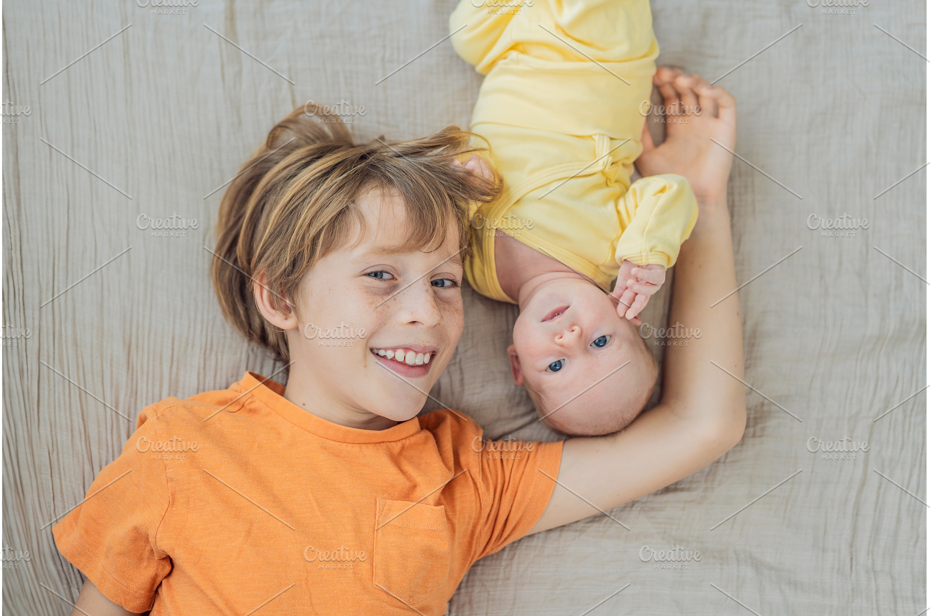 A young boy and his newborn brother, a Person Photo by Elizaveta Galitskaya