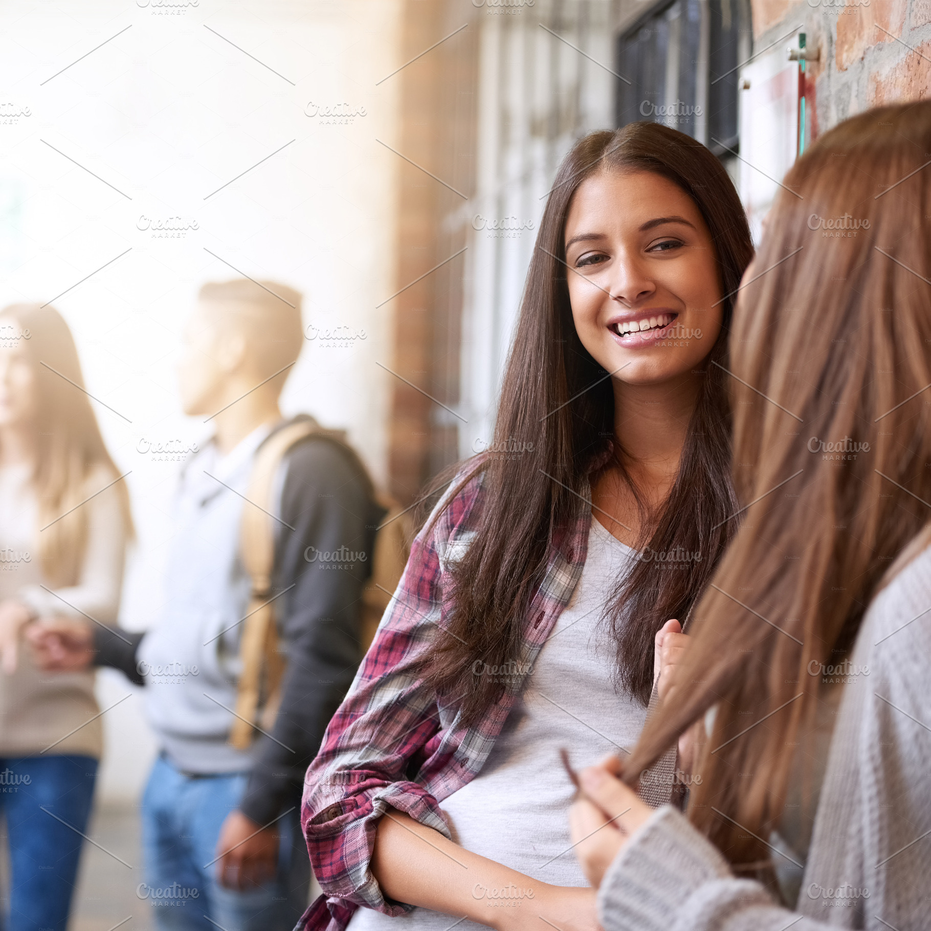 Catching up between classes, a Photo by Peopleimages.com