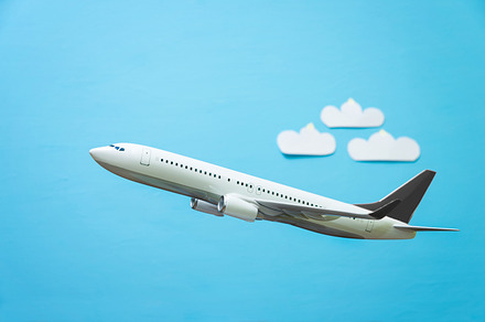 white airplane on a blue 