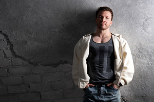 Man in fleece hoodie and jeans, a Person Photo by Elena Vagengeim
