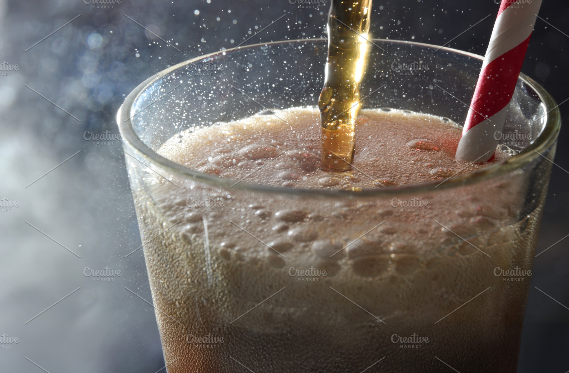 Detail of glass cup filled with refreshing drink dark background, a Food & Drink Photo by Davizro's Market