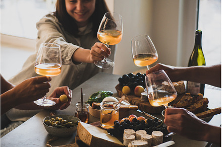Glasses of white orange or rose wine, a Food & Drink Photo by Foxys