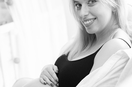 Portrait of a Young pregnant woman in studio lighting, black and, a Person Photo by rubenchase