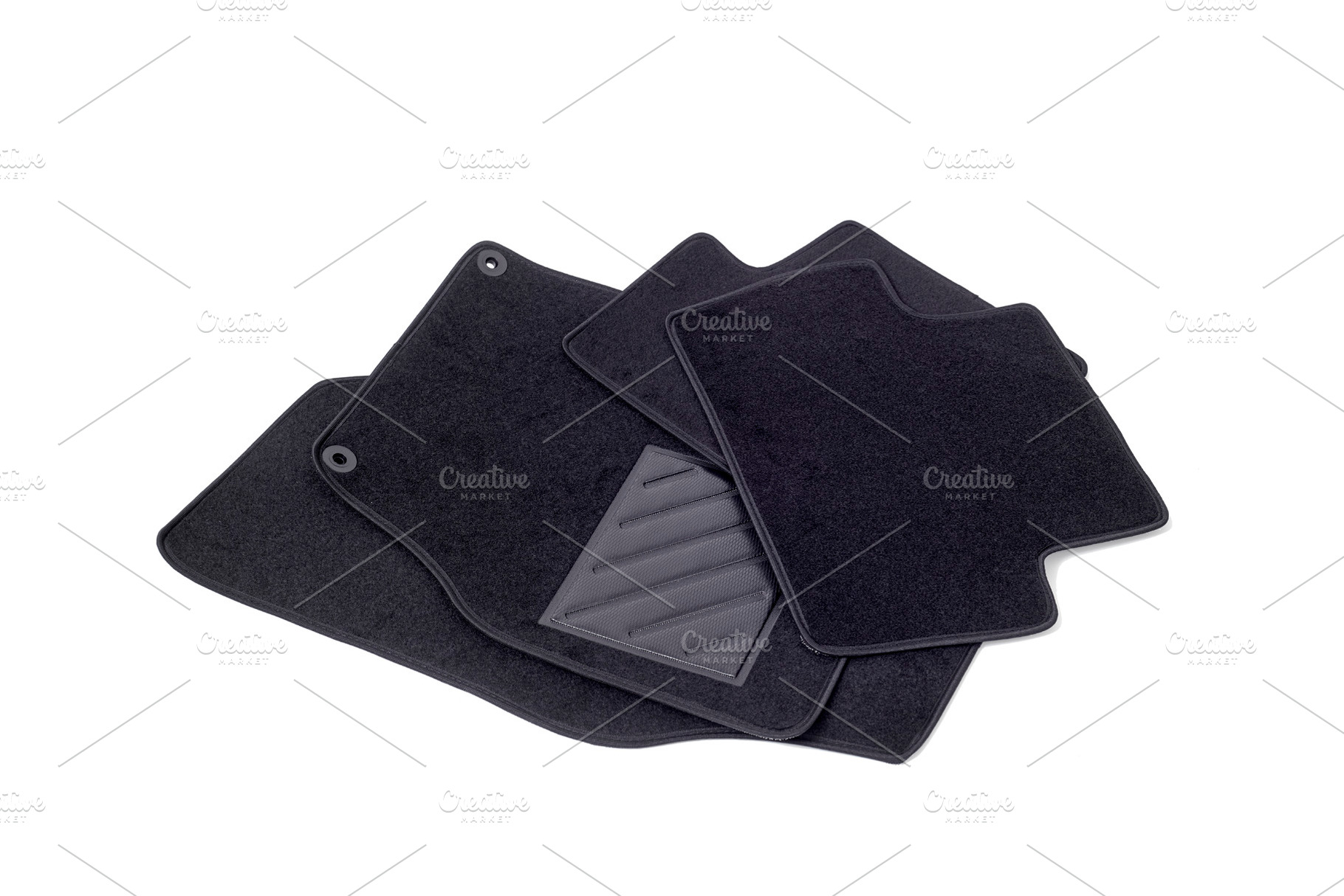 set of generic black car floor mats, a Photo by Nito