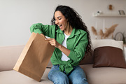 Joyful Customer Woman Unpacking Package After Successful Shopping At Home, a Photo by Prostock-Studio (Thumbnail 3 of 4)