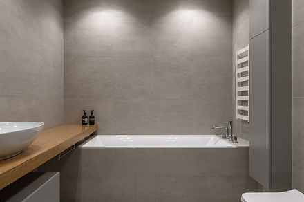 Stylish modern bathroom with light stock photo containing interior and modern