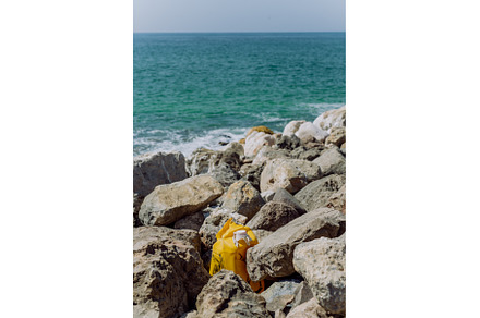 Garbare on stone beach, near the sea, an Industrial Photo by HalfPoint