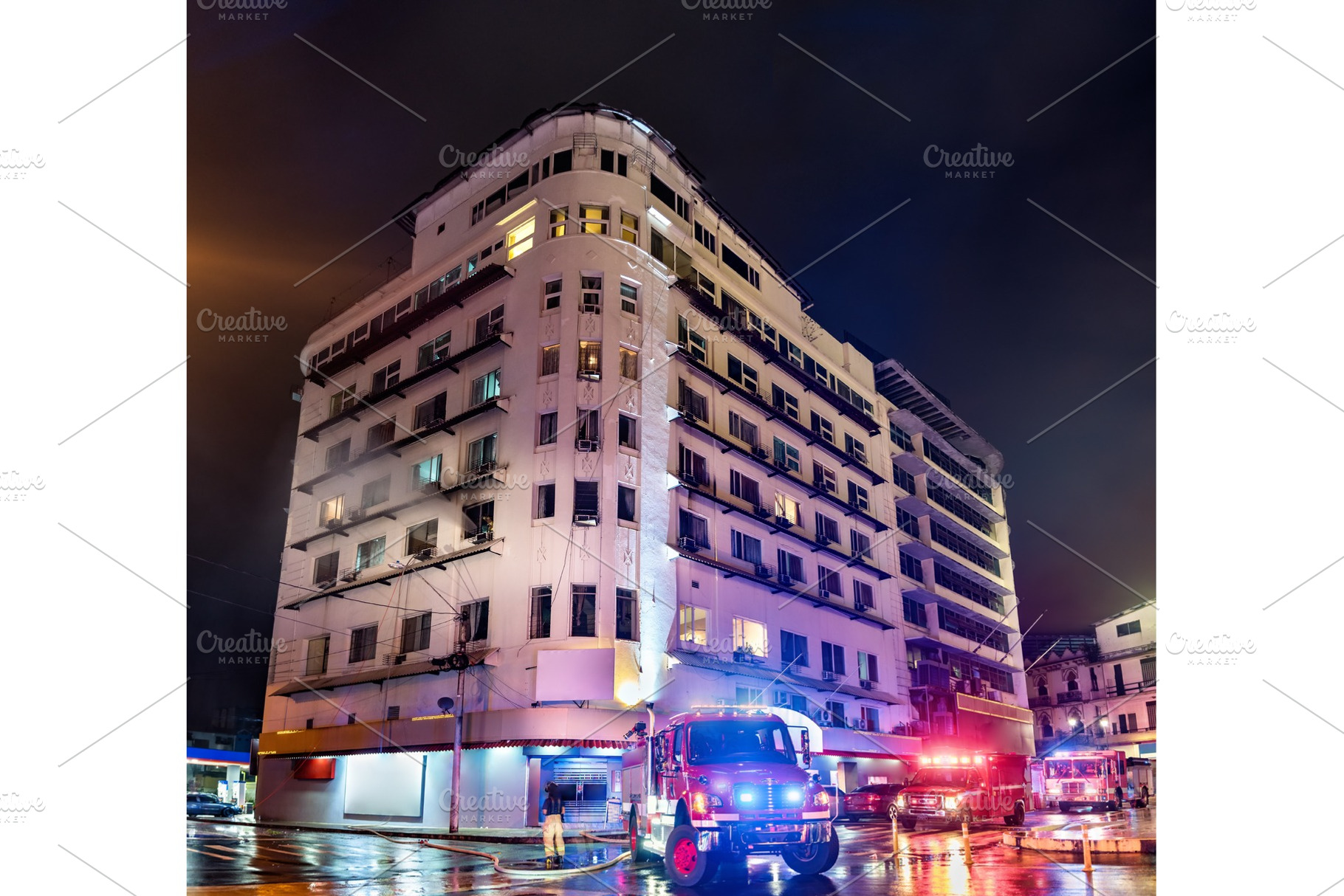 Firefighters at a burning building, an Architecture Photo by Leonid Andronov