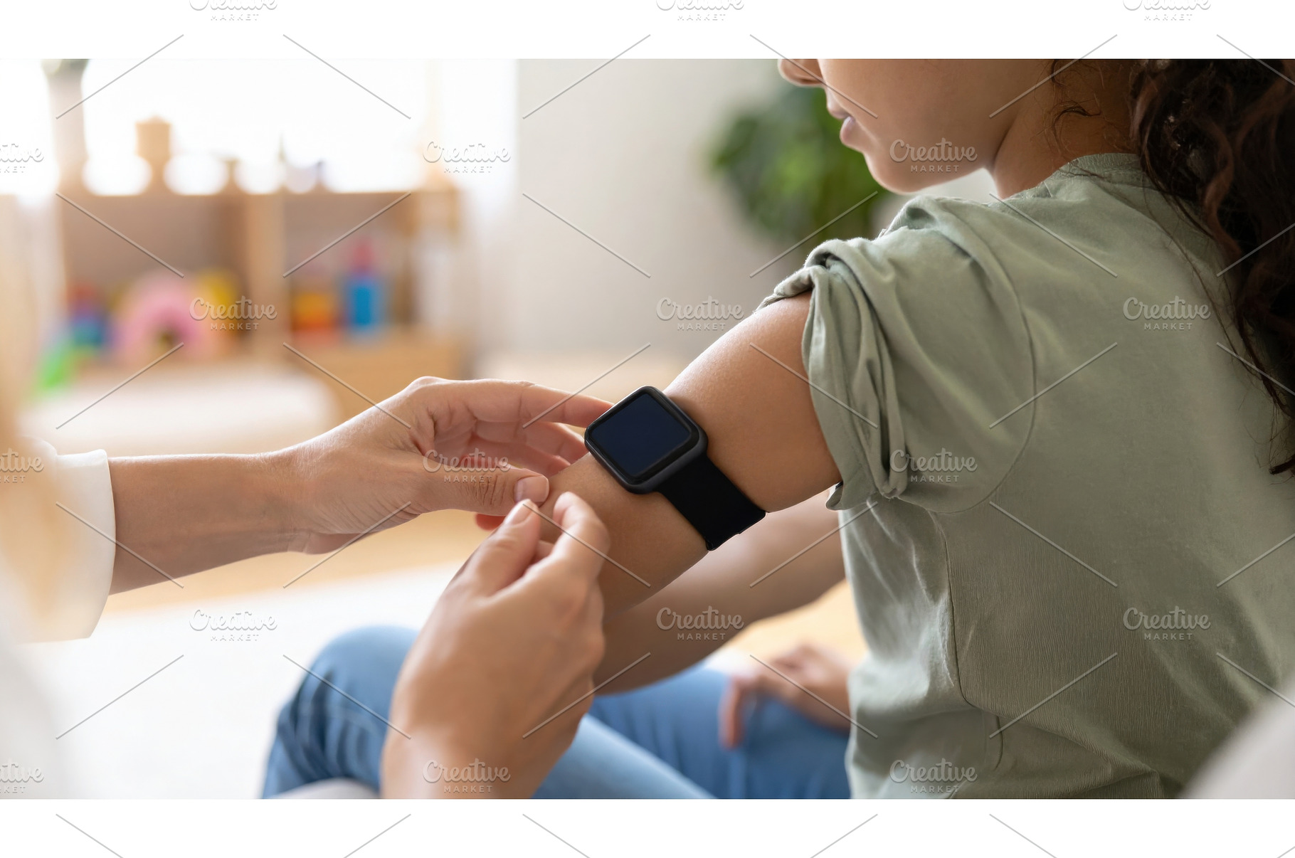 A child wearing a smartwatch getting, a Technology Photo by Igor Tichonow