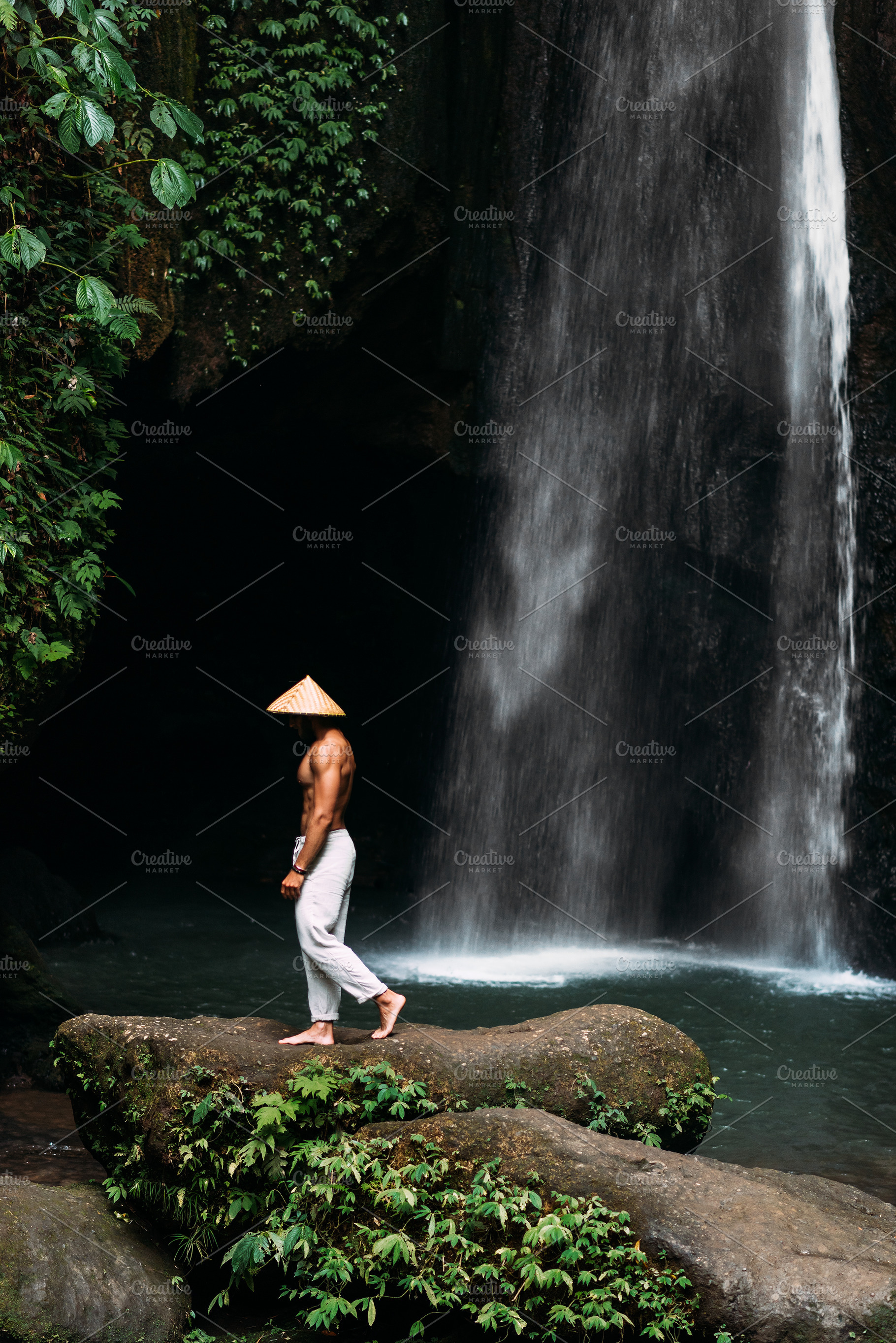 Man at the waterfall containing active, activity, and adventure, a Person Photo by SOTNIKOV_MISHA